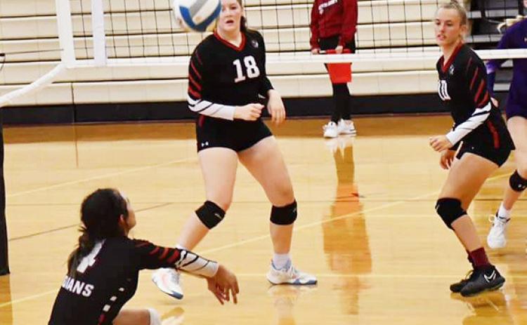 Michelle Gallegos reads the ball as Sidney Biermann and McKenzie Porter transition for the attack. Photo by Misty Gardner
