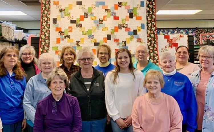 Pictured (Back Row, L-R): Tammy Landis, Cheryl Whalen, Deb Bauck, Rita Simons, Roxana Reyes. Middle Row (L-R): Stefanie Perry, Betty Jean Tedford, Aimee Baker, Dorene Reimer, Susan Wedel Front Row (L-R): Deb Case, Belinda Oldham. photo courtesy Dorene Reimer