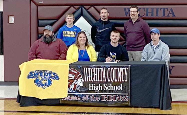 Pictured left, back row, l-r: Wyatt Gardner; Coach Cooper, WCHS Assistant Wrestling Coach; Nate Brown, WCHS Head Wrestling Coach; front row, left to right: Ben Gardner; Misty Gardner; Jesse Gardner, Coach Strauss, Bethany College Head Wrestling Coach