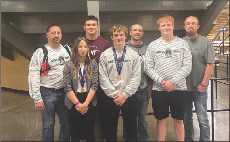Left: State Team and Coaches: Back Row: Coach Brent Porter, Isaiah Gerstberger, Coach Wes Cooper, Coach Matt Price Front: Jentri Por ter, Wyatt Gardner, Brandon Price. Photo by Janee Porter