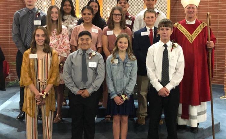 Shown above are, Bottom Row, L-R: Audrina Marcy, Valentin Alvarado, Breanne Ricke and Byron Grilliot; Middle row: Addison Simons, Monserrat Orozco, Marcy Baker, Zane Gerstberger and Bishop Vincke; Top row: Jaden Grilliot, Paola Barrera, Aniyssa Holguin, Pablo Reyes and Luis Holguin. Story and photo courtesy Fr. Timothy S. Hickey