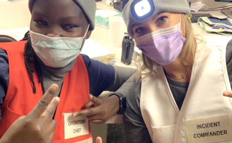 Marina Achieng and Mindi Bremer get in the spirit of the day.