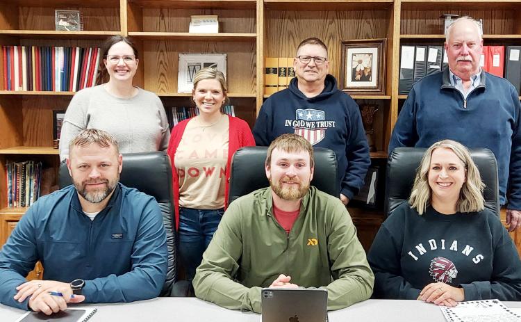 Newly-elected members of the USD 467 Board of Education joined the three incumbent members in getting to work for the district. Pictured above, back row (L-R): Maegan Berry, Eryka Smith, Bruce Loy, Farrin Watt, all new members. Front Row (L-R): Josh Young, Jesse Harbrige, Julee Beedy. Photo courtesy Tammy Mason